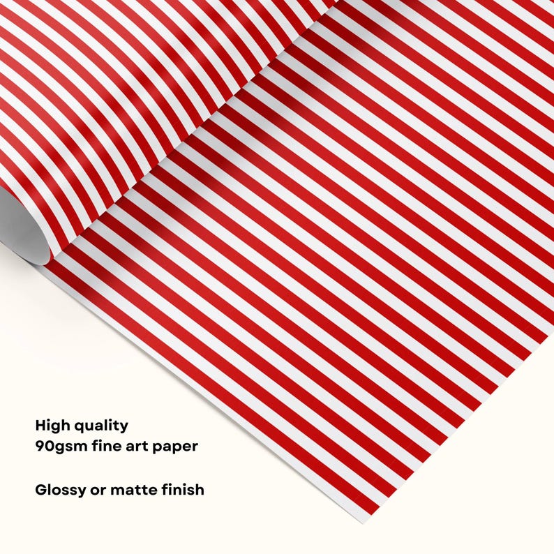Puede incluir: Una hoja de papel con un patr&oacute;n repetitivo de finas rayas verticales rojas y blancas. El texto en la imagen dice: High quality 90gsm fine art paper. Glossy or matte finish. El papel se muestra parcialmente enrollado en el borde superior.
