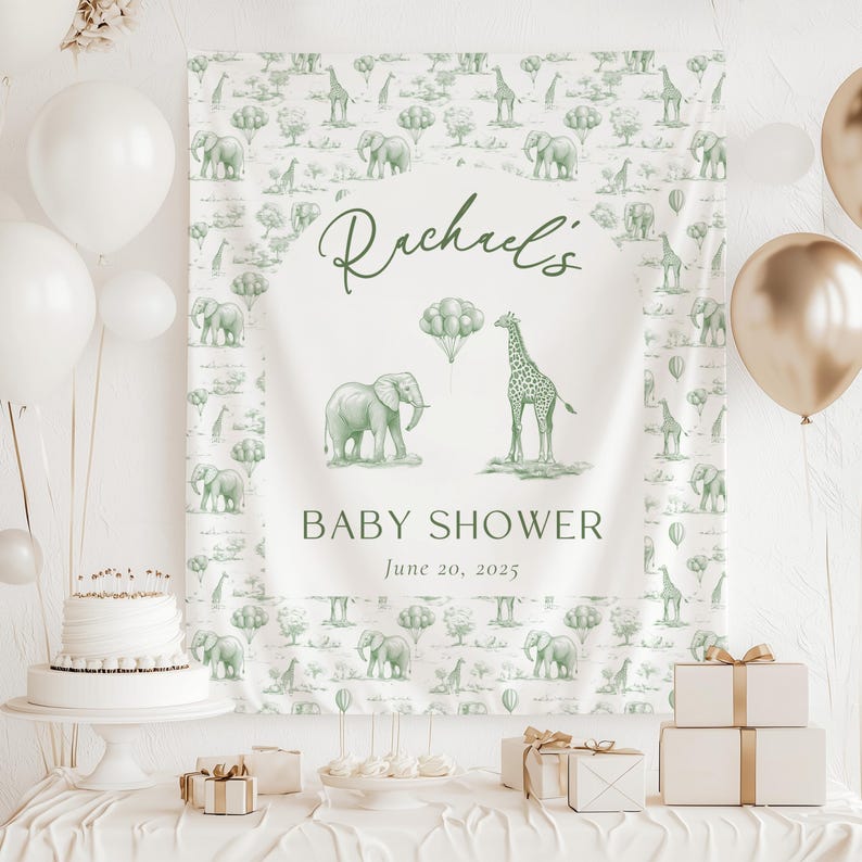 May include: A rectangular fabric backdrop featuring a repeating sage green pattern of elephants, giraffes, and trees. The center displays the text "Rachael's BABY SHOWER June 20, 2025" with illustrations of an elephant, a giraffe, and balloons.