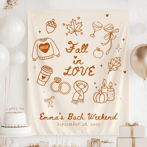 Pode incluir: Uma faixa creme com ilustrações e texto em castanho. A faixa apresenta desenhos de itens com tema de outono, como um suéter, folhas e abóboras. O texto diz "Fall in Love" e "Emma's Bach Weekend, September 28, 2025."