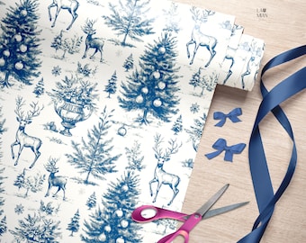 May include: A roll of white wrapping paper featuring a blue ink illustration of deer, Christmas trees with ornaments, and urns. The paper is accompanied by two small blue bows, a long blue ribbon, and a pair of pink-handled scissors.