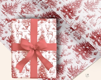 May include: A rectangular gift box wrapped in white paper with a repeating red toile-style pattern featuring deer, Christmas trees, and urns. A solid coral-red ribbon is tied in a bow around the center of the box. The paper is also shown unfolded.