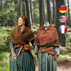 May include: Two women wearing brown knitted shawls with black stripes. The shawls are wrapped around their shoulders and tied at the waist. The women are standing in a forest setting.