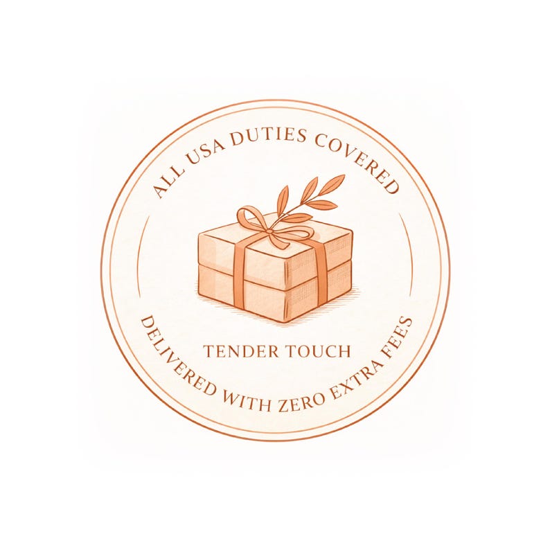 May include: A circular illustration with a gift box tied with a ribbon and a sprig of leaves. The text reads "ALL USA DUTIES COVERED" and "DELIVERED WITH ZERO EXTRA FEES". The words "TENDER TOUCH" are also included.