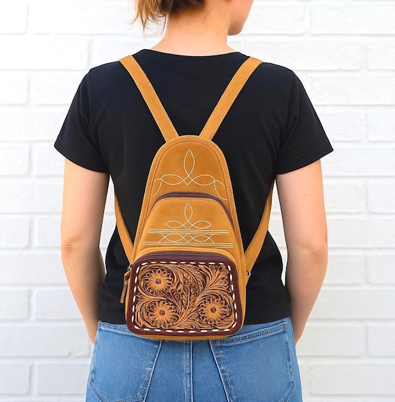 carved leather backpack John Wayne ~ Black Fit and Color Options Adjustable shoulder straps measure approximately 6070 cm Hand Carved Leather and Suede