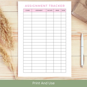 May include: A printable assignment tracker with columns for course, assignment, due date, grade, and done. The tracker has a pink header and is on a wooden surface.