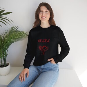 Believe Angel Unisex Heavy Blend™ Crewneck Sweatshirt