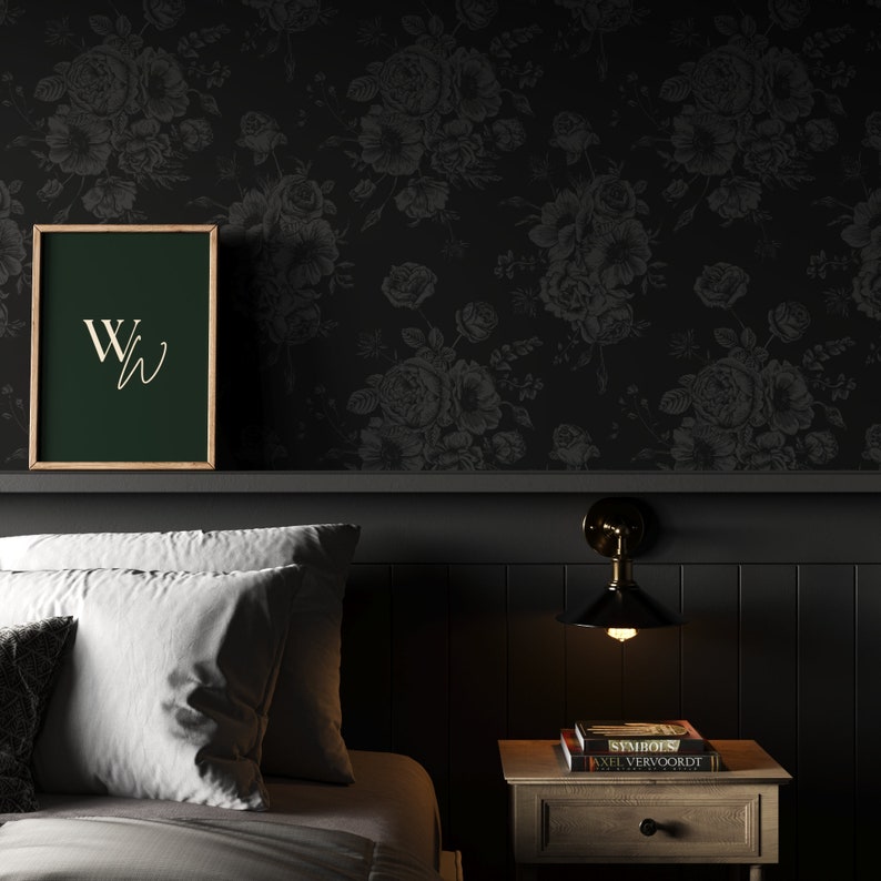 This image showcases the wallpaper pattern in a bedroom mockup. The wallpaper pattern has a solid black background with subtle dark grey floral illustrations.
