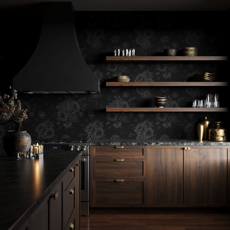 This image showcases the wallpaper pattern in a kitchen mockup. The wallpaper pattern has a solid black background with subtle dark grey floral illustrations.