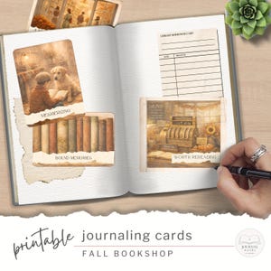 May include: An open journal with printable journaling cards, themed around a fall bookshop. The cards depict scenes of reading, stacks of books, and a vintage cash register. Text on the cards reads "Mesmerizing", "Bound Memories", and "Worth Rereading".