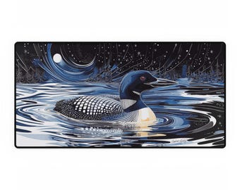 May include: A rectangular desk mat featuring a detailed illustration of a loon swimming in a lake under a starry night sky. The loon has a black head, white and black patterned back, and a white belly. The water is depicted in shades of blue and black.