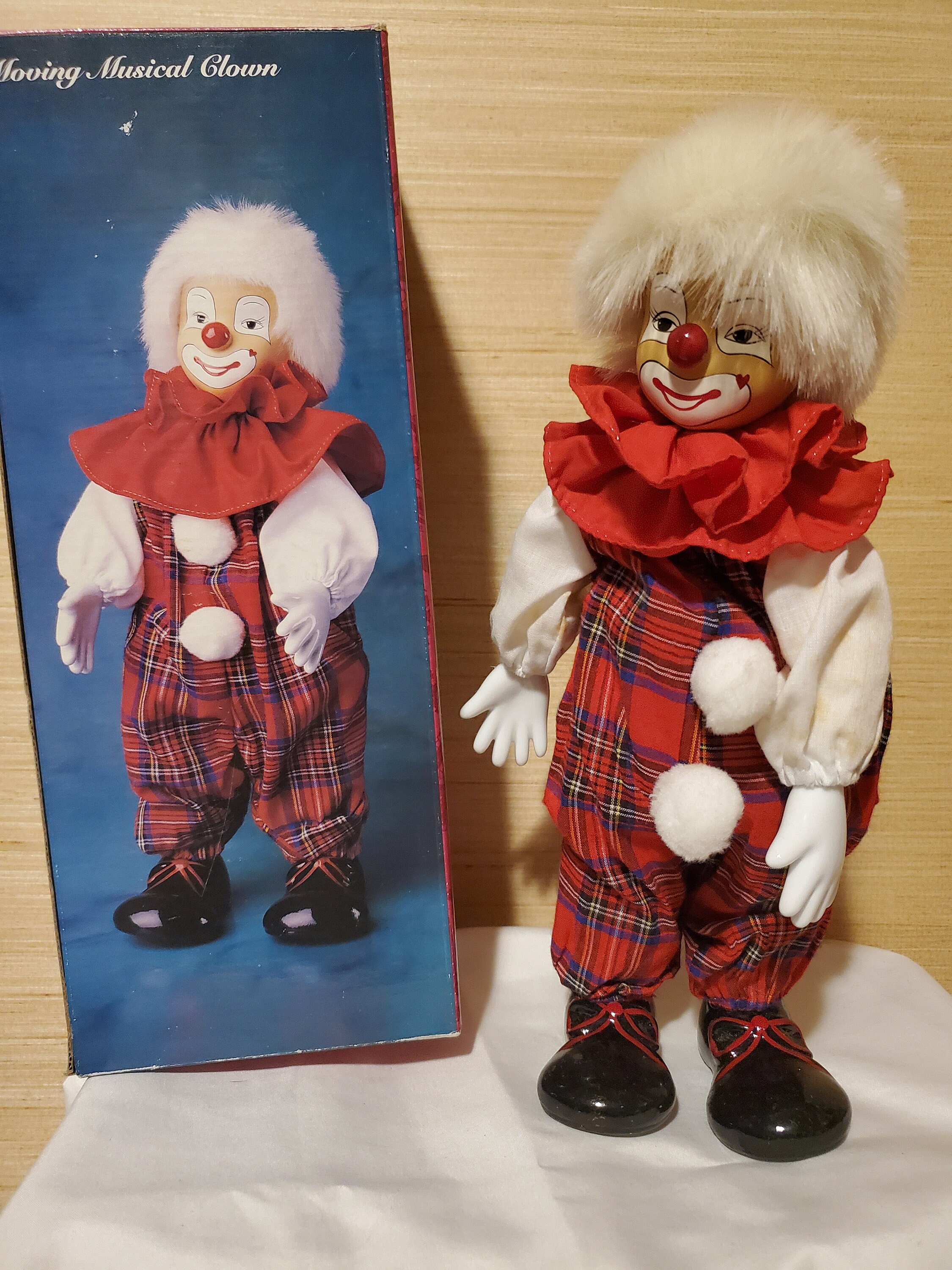 Musical porcelain clown doll clearance