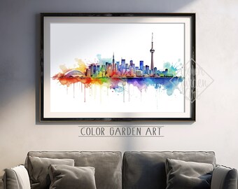 May include: A watercolor painting of the Toronto skyline with a rainbow color scheme. The CN Tower is the tallest building in the painting. The painting is framed and hanging on a wall in a living room.