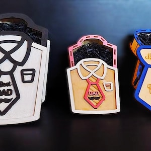 May include: Three wooden boxes shaped like shirts and ties. The boxes are decorated with a tie, collar, and the words "Best Dad" and "Happy Father's Day".