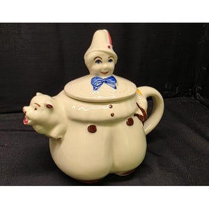 Tetera figurativa de cerámica Shawnee Pottery "Tom the Piper's Son" de la década de 1940 con boquilla en forma de cerdo. Fabricada en EE. UU.