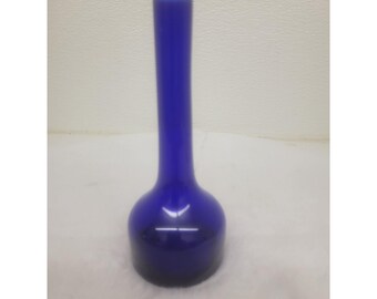 May include: A cobalt blue glass vase with a round base and a long, slender neck.
