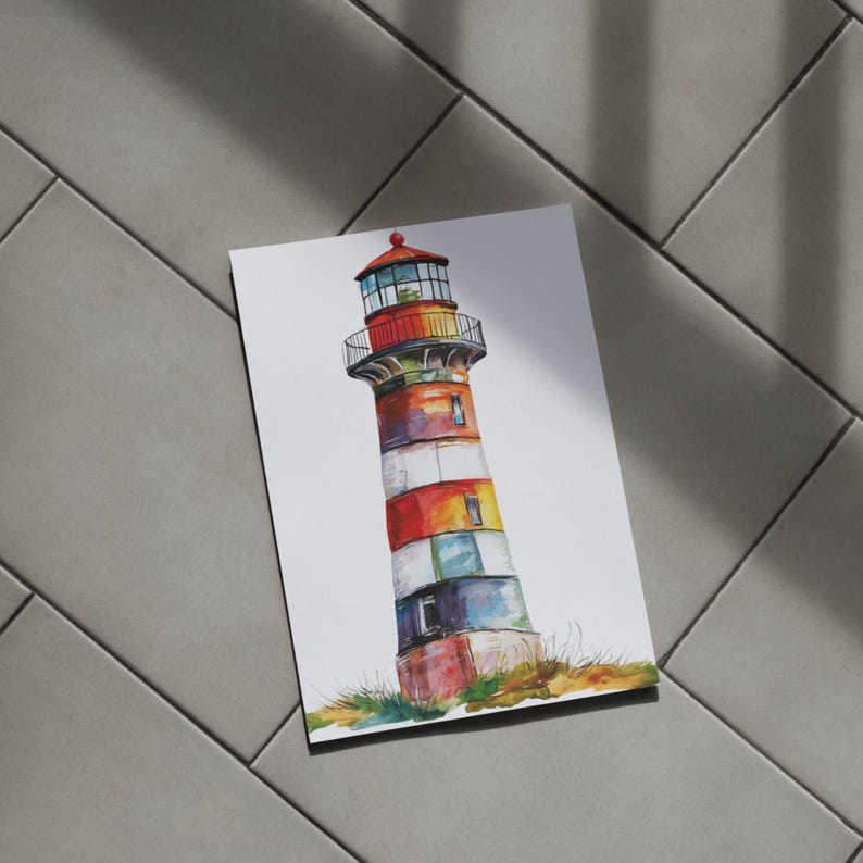 May include: Watercolor painting of a colorful lighthouse. The lighthouse features red, white, blue, yellow, and green stripes. The top has a red roof and a black railing. The base of the lighthouse is surrounded by green and brown grass.