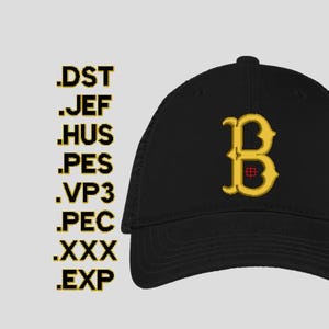 May include: Black baseball cap featuring a gold embroidered letter "B" with a red detail. The cap has a curved peak and a mesh back. The image also includes embroidery file extensions: .DST, .JEF, .HUS, .PES, .VP3, .PEC, .XXX, and .EXP.