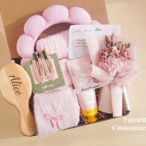 May include: A pink-themed gift box containing a headband, hair clips, a brush engraved with "Alice", a small bouquet, and beauty products. The box is labelled "Favorite Customized".
