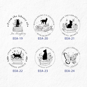 May include: Six black and white circular rubber stamps with different designs. Each stamp features a book stack, flowers, and a different animal or design. The stamps are labeled with the text "From the library of" and a name. The text "EEA-19" through "EEA-24" is below each stamp.