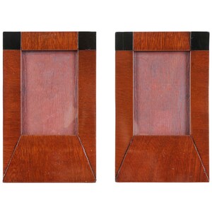 May include: Two wooden picture frames with black trim. The frames are empty and ready for photos.