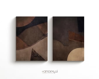 May include: Two abstract art prints with geometric shapes in shades of brown, beige, and gray. The prints are framed and ready to hang.