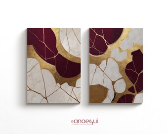 May include: Two abstract paintings with a gold and burgundy color scheme. The paintings feature a cracked, marbled design with gold veins.