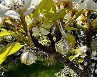 Silver pearl earrings.