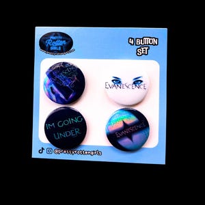 May include: A set of four round buttons with the band name "Evanescence" and the text "I'M GOING UNDER". The buttons are on a light blue card with the text "4 BUTTON SET" and the Pretty Rotten Girls logo.