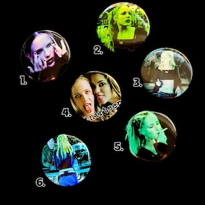 May include: Six circular pin-back buttons featuring photographic stills from the movie Thirteen. Each button displays a different scene with characters, including close-ups and group shots, with some images tinted in green and black tones.