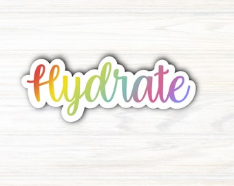 May include: A rainbow-colored sticker with the word "Hydrate" written in a cursive font.