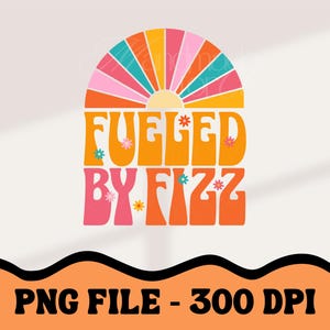 May include: A digital graphic design featuring a retro-style rainbow arch with the text "Fueled by Fizz" in orange and pink letters. The design is set against a white background.