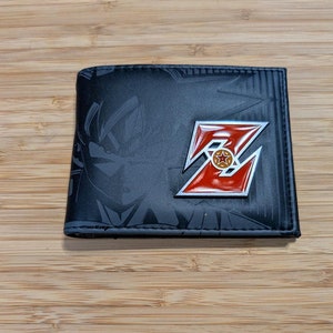 Cartera plegable con insignia de metal del logo de dibujos animados de DBZ