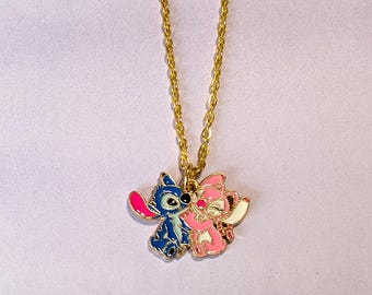 Stitch and Angel 1" Wide Goldtone Metal Enamel Pendant Necklace