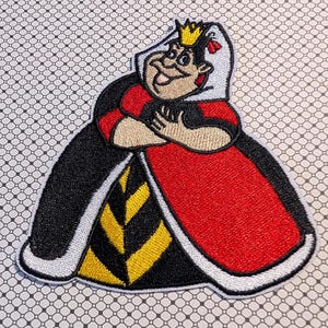 May include: Embroidered patch featuring the Queen of Hearts from Alice in Wonderland. The patch has a cartoon design with a red, black, white, and yellow color scheme. The Queen is depicted with a gold crown and crossed arms.