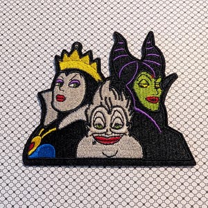 May include: Embroidered patch featuring three cartoon villains: The Evil Queen with a gold crown, Ursula with gray skin, and Maleficent with black horns. The patch has a black border and is on a patterned background.