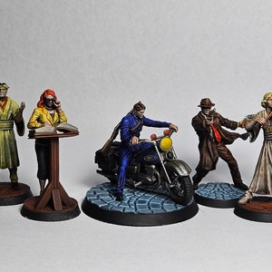 May include: Five painted miniature figures, each on a circular base, depicting a variety of characters. One figure is a man in a yellow robe, another is a woman in a red dress, another is a man in a blue suit riding a motorcycle, another is a man in a brown coat, and the last is a woman in a white dress playing a violin.