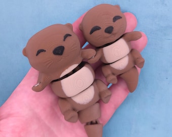 Paar gelede otters | Magnetische handvast-otters | 3D-geprinte Flexible Desk Pets | Otterbeeldjes