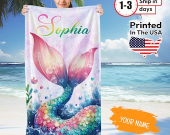 May include: A colorful mermaid tail beach towel with a pink, blue, and green mermaid tail design. The towel has the name "Sophia" printed on it.