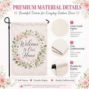 May include: A rectangular garden flag featuring the text Welcome to Our Home in black script, surrounded by a floral wreath of pink flowers and green leaves. The flag is displayed on a black metal stand and includes close-up fabric details.