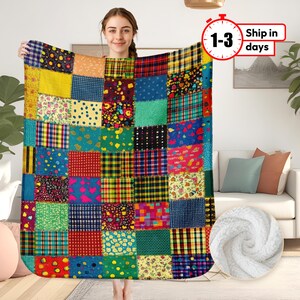 May include: A colorful patchwork quilt throw blanket with a variety of colors and patterns, including red, green, blue, yellow, and white. The blanket is made of soft, comfortable fabric and is perfect for adding a touch of warmth and style to any room.