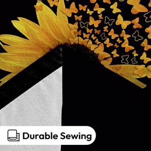 May include: A black and white fabric with a sunflower design and a scattering of yellow butterflies. The text "Durable Sewing" is printed on the fabric.