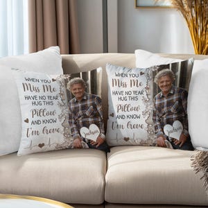 May include: Two decorative throw pillows with a photo of a person in a plaid shirt, a heart-shaped name tag, and the text "WHEN YOU Miss Me, HAVE NO FEAR, HUG THIS Pillow AND KNOW I'm here."
