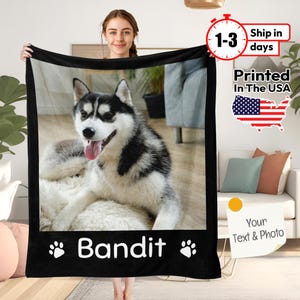 May include: Black and white fleece blanket featuring a photo of a husky dog with the name "Bandit" printed on it.