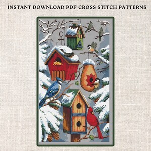 May include: Cross stitch pattern featuring a winter scene with birdhouses, snow-covered branches, and birds. The birdhouses are red, green, and brown, and the birds are blue, red, and brown.
