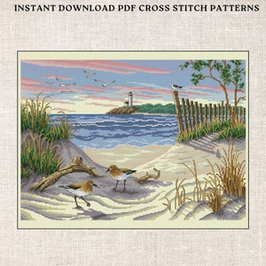 May include: A cross stitch pattern featuring a beach scene with a lighthouse in the distance, seagulls flying overhead, and two sandpipers on the sandy shore.