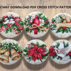 May include: Six round cross-stitch Christmas ornaments. Designs feature birds, a cardinal, a reindeer, bells, a poinsettia, and a dove. The text "INSTANT DOWNLOAD PDF CROSS STITCH PATTERNS" is at the top.