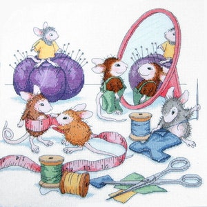 May include: Five mice are sewing and measuring fabric. One mouse is sitting on a purple pincushion, another is looking in a mirror, and three are using a measuring tape. There are spools of thread, scissors, and a piece of blue fabric.