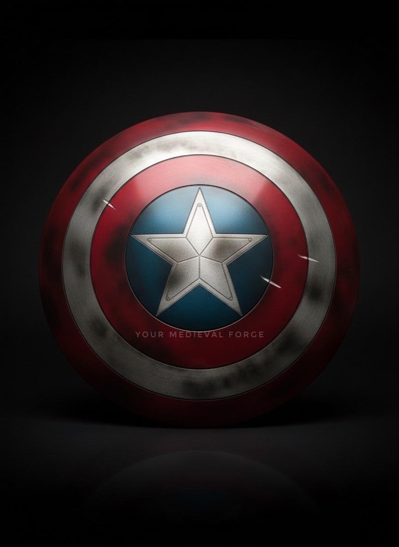 May include: A round shield with a red and silver outer ring, a blue center with a silver star, and the text "YOUR MEDIEVAL FORGE" at the bottom. The shield has a distressed, battle-worn appearance.