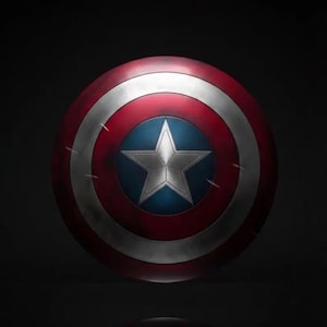 May include: A round shield with a red, white, and blue color scheme. The shield features a white star on a blue circle in the center, surrounded by white and red concentric rings. The shield has a metallic appearance.