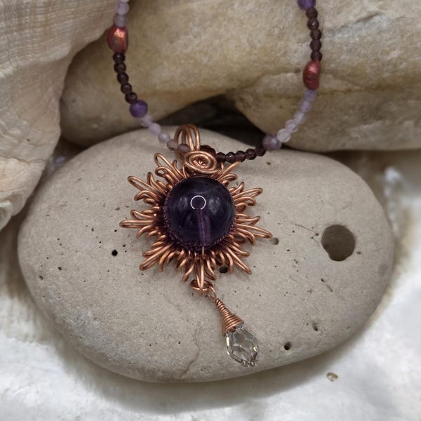 Unique Amethyst and sunburst necklace with a multi gemstones chain.